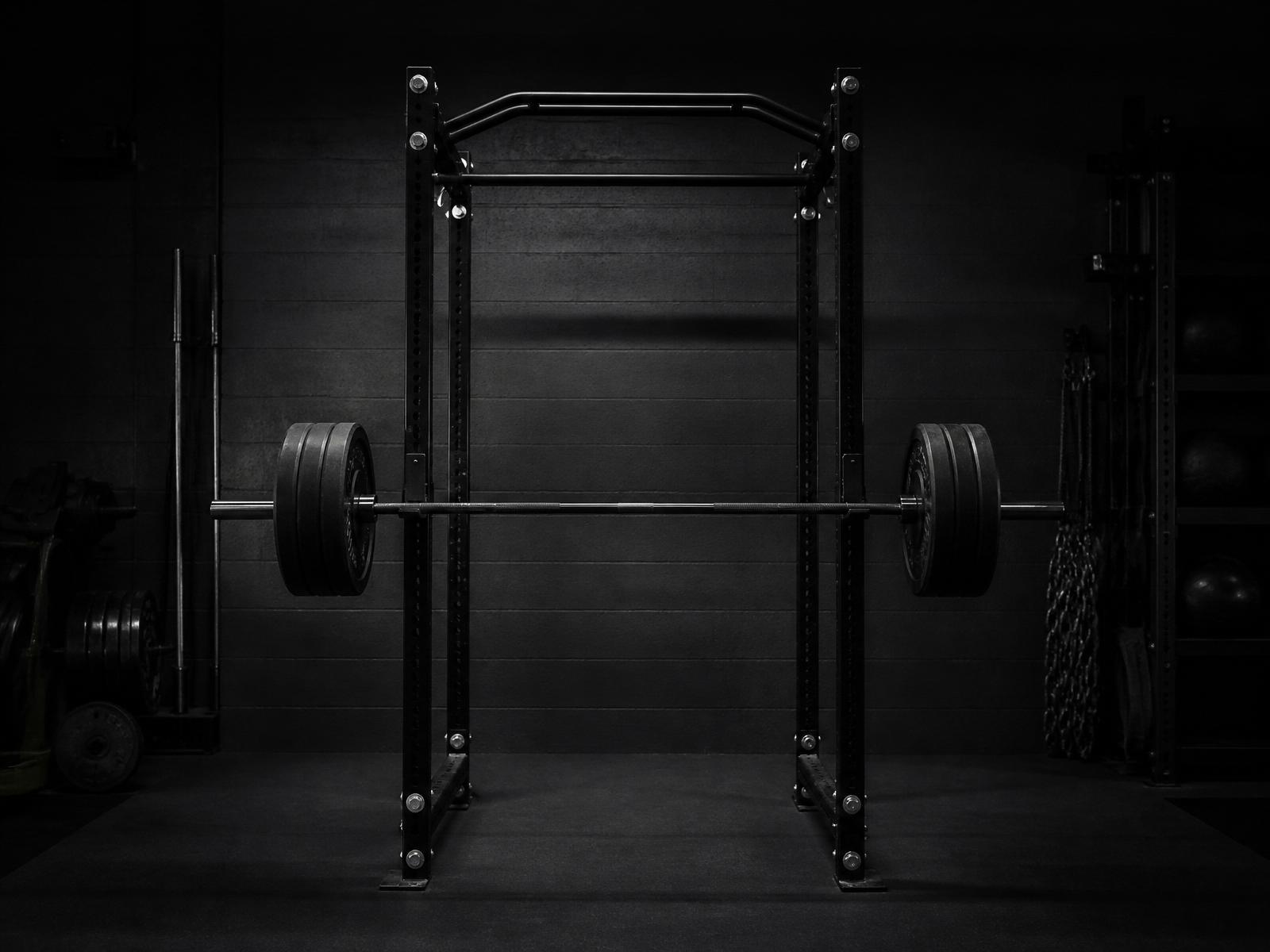 Power rack with loaded barbell